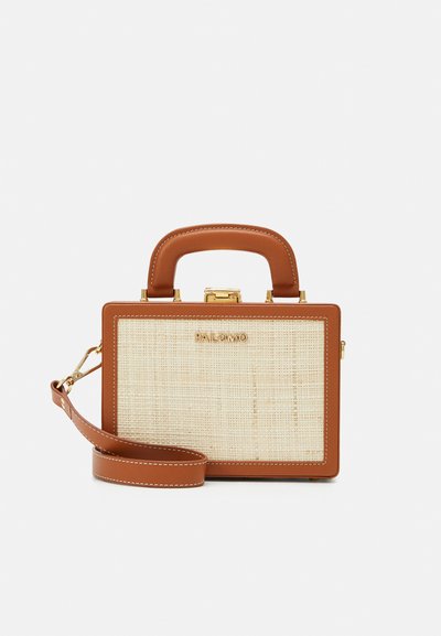 Brown faux leather handbag with a rectangular shape, woven beige front, gold hardware, and a detachable strap and handle.