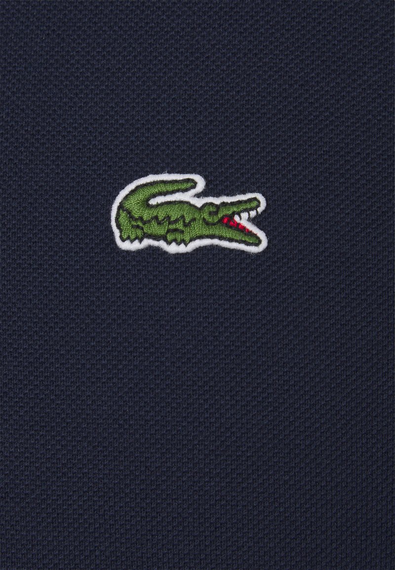 lacoste polo logo