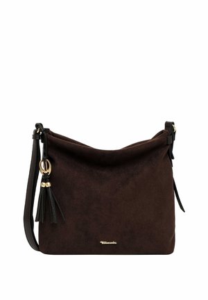 Dark brown suede shoulder bag with adjustable strap, gold-tone logo, and decorative tassel charm on a white background.