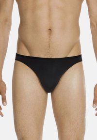 Bikini intimo da uomo in colore nero con un design minimalista, realizzato in tessuto morbido, dotato di un cinturino basso e vestibilità aderente.
