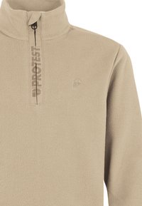 Beige fleece trui met hoge kraag, halve rits aan de voorkant en logo-opdruk. Zachte textuur met een klein embleem op de borst.