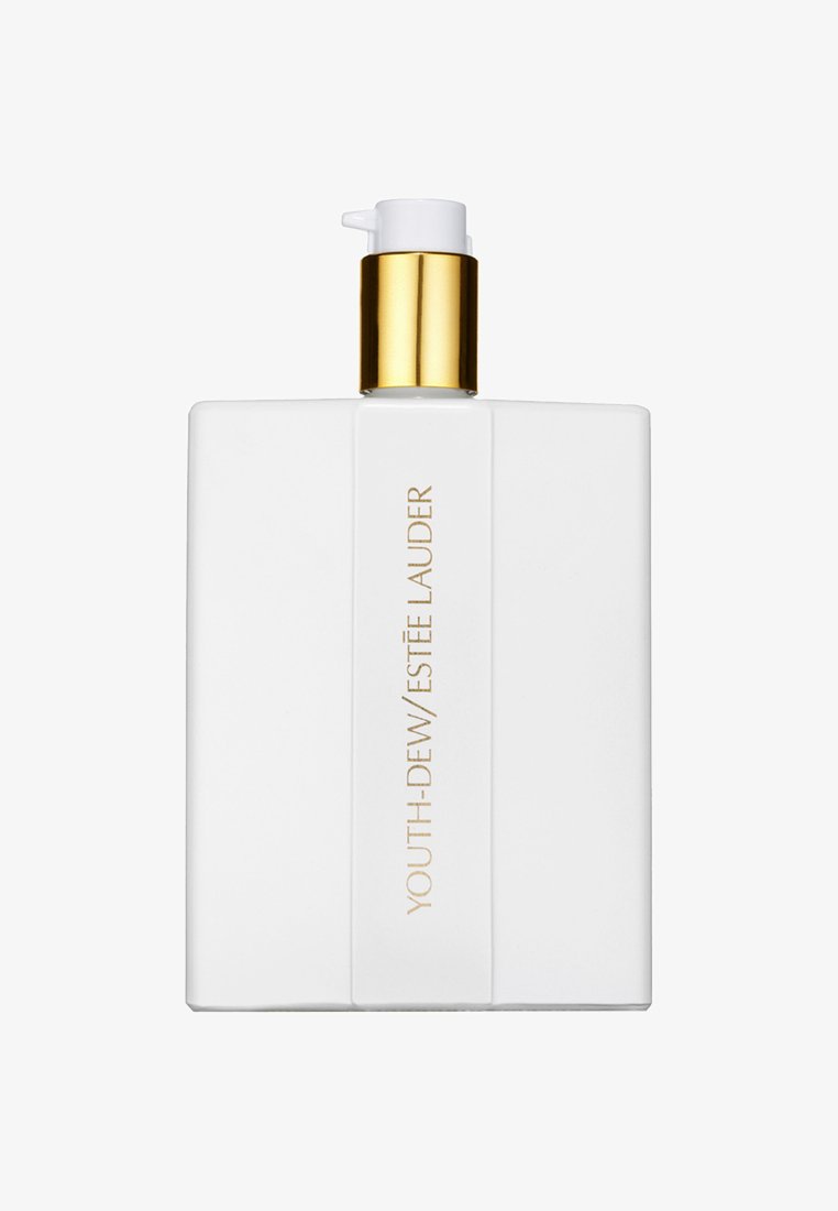 Biała prostokątna butelka z pompką. Złote wykończenie na pompce. Etykieta z napisem "YOUTH-DEW/ESTÉE LAUDER" w złotych literach.