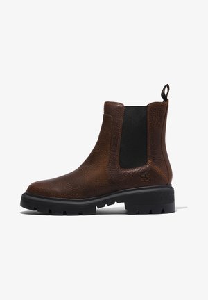 Brown leather Chelsea boots with a textured finish, elastic side panels, and a black rubber sole featuring a lugged tread pattern.