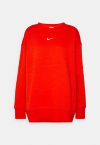 Rotes Sweatshirt aus Baumwollmischung mit Rundhalsausschnitt, überschnittenen Schultern und kleinem weißen Nike-Logo auf der Brust.