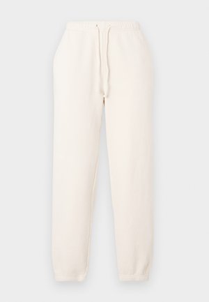 Φόρμες σε κρεμ χρώμα από μαλακό ύφασμα. Διαθέτουν ελαστική μέση με ρυθμιζόμενο κορδόνι και ελαστικά τελειώματα στους αστραγάλους.