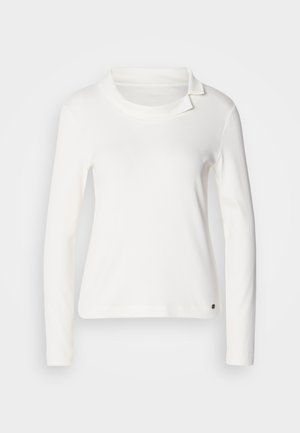 White long-sleeve top with a boat neck and a folded collar detail. Made of soft fabric with a smooth texture. Small logo accent at the hem.