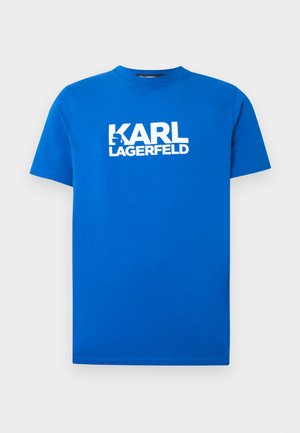 Blaues Baumwoll-T-Shirt mit kurzen Ärmeln und Rundhalsausschnitt. Auf der Vorderseite befindet sich der weiße aufgedruckte Schriftzug "KARL LAGERFELD". Glatte Textur.