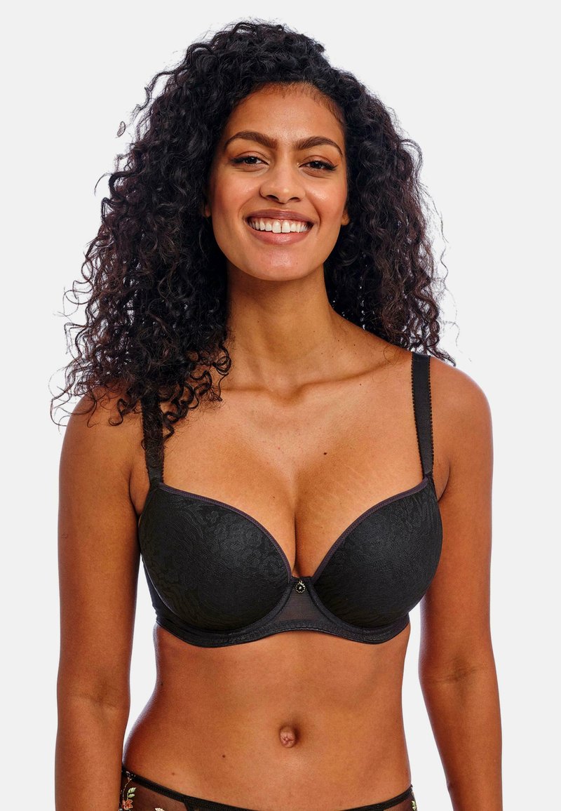 Black lace push-up bra with textured floral pattern, underwire support, adjustable straps, and a decorative center accent.