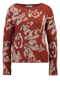 Striktrøje i rustfarve med et blomsterprint i lysebeige og sort. Rund halsudskæring, lange ærmer og struktureret stof.