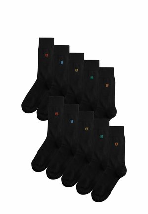 Chaussettes en coton noires avec des logos brodés colorés (rouge, bleu, vert, orange) sur les bordures ; vendues par paquet de dix.