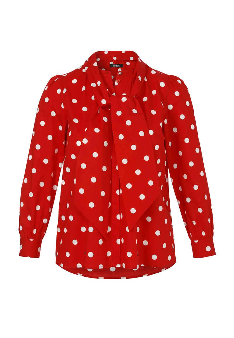 Blouse rouge à pois blancs, avec un nœud au col, manches longues et boutonnière, fabriquée en tissu lisse.