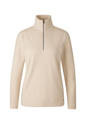 Beżowy sweter typu pullover z wysokim kołnierzem i zamkiem na ćwierć długości, długie rękawy, gładka faktura i minimalistyczny design. Zawiera subtelne detale przeszyć.