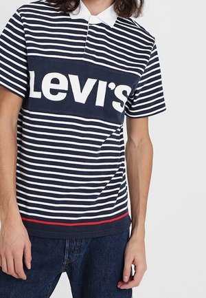 Navy and white striped polo shirt with a white collar and a large Levi's logo in the center, featuring a red stripe at the hem.