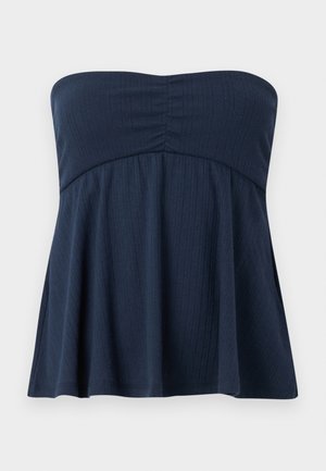 Navy blue strapless top with a fitted bodice and a flared lower half, featuring a textured ribbed pattern and soft fabric.