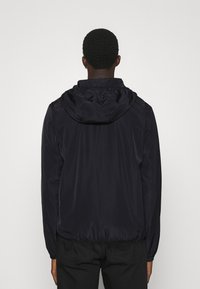 EA7 Emporio Armani JACKET - Kevyt takki - black/white