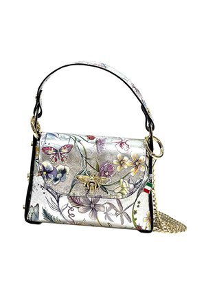 Handbag in silver leather with floral and butterfly patterns. Features a gold bee emblem, black trim, and a detachable chain strap.
