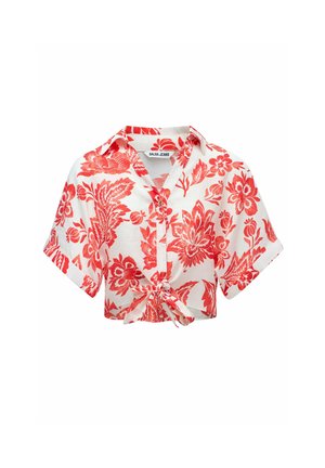 Chemise à manches courtes courte en blanc avec un motif floral rouge audacieux, dotée d'un devant boutonné et d'un détail de ourlet noué. Fabriquée en tissu léger.