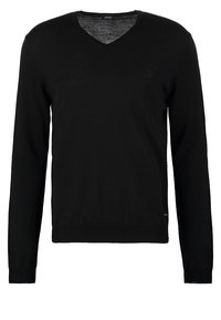 Maglione nero a V, maniche lunghe, realizzato in un morbido tessuto a maglia. Design semplice, senza motivi o decorazioni, presenta un piccolo tag con logo.