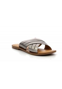 Leather slide sandal featuring a metallic silver upper with horizontal cutouts, a tan leather insole, and a flat sole.