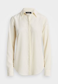 Long-sleeve, collared shirt in cream color. Made of smooth fabric with a button-front closure and a rounded hem. Simple and classic design.