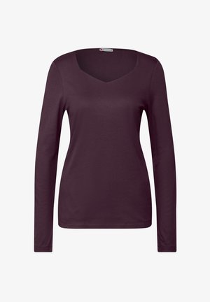 Pitkähihaisessa, syvän burgundinvärisessä paidassa on V-kaula-aukko. Suhtee, mukautuva muoto ja yksinkertainen reunan viimeistely.