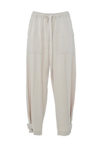 Hellbeige, locker sitzende Hose mit elastischem Bund, Kordelzug und zwei großen vorderen Taschen. Die Säume sind mit Knöpfen gesichert.