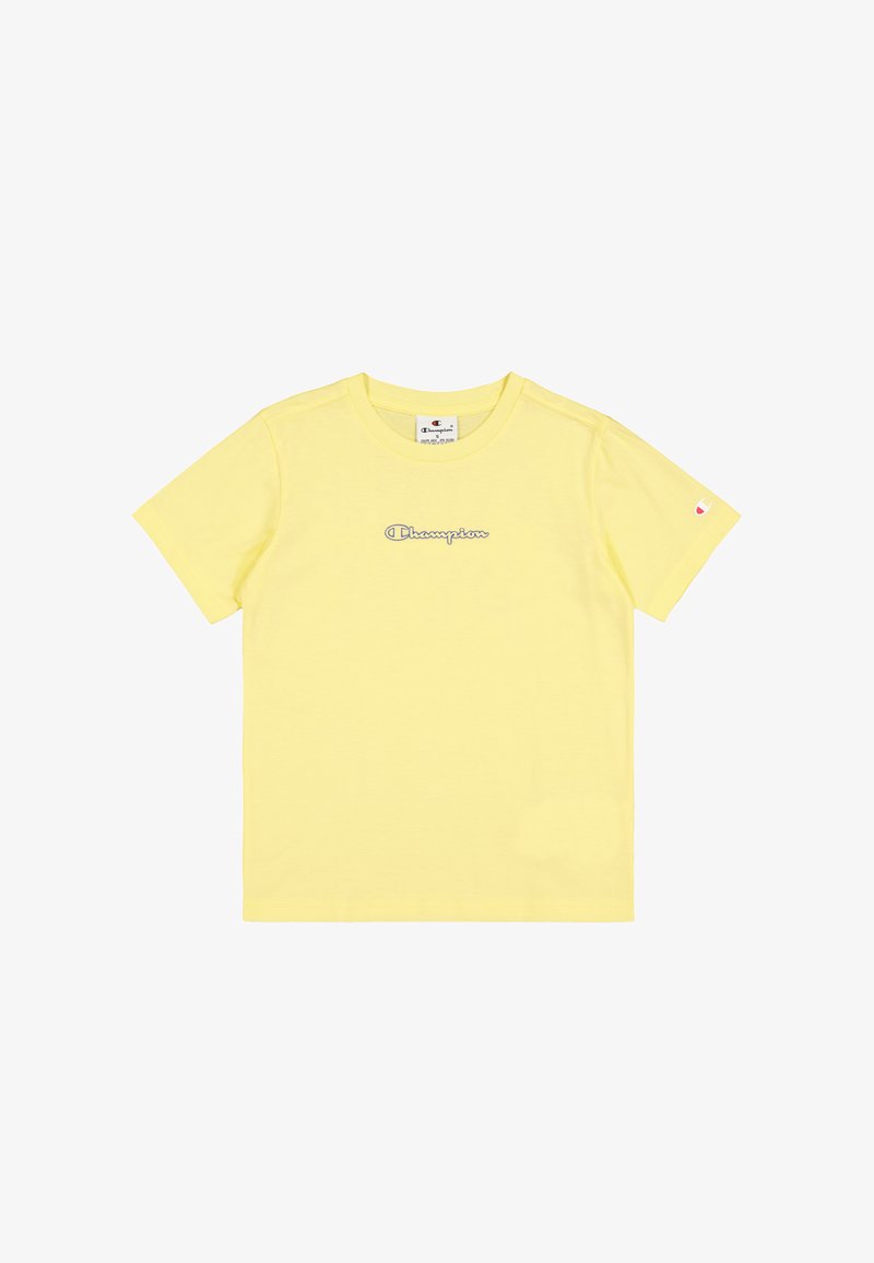 Camiseta amarilla de manga corta hecha de algodón suave, con un ligero bordado del logo "Champion" en azul. Diseño minimalista, cuello redondo clásico.