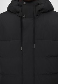 Black puffer jacket featuring a hood, front snap buttons, and adjustable drawstrings. Smooth fabric with stitched panel detailing.