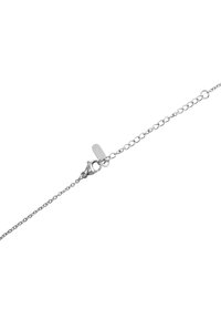 Silver chain bracelet with a lobster clasp, featuring small round links and a flat tag engraved with brand logo. Smooth texture throughout.