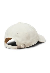 Beige cotton baseball cap with a curved brim, adjustable strap at the back, and small ventilation holes. Structured design with textured fabric.
