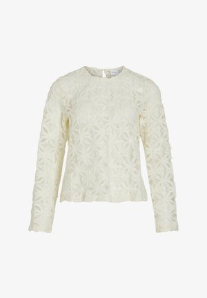 Bijela bluza dugih rukava napravljena od teksturiranog materijala s cvjetnim vezom. Ima okrugli izrez i zatvaranje na leđima uz oblik ključa.