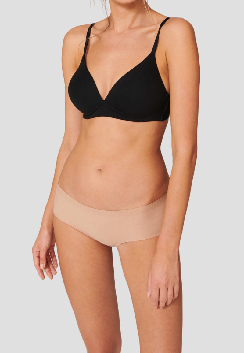 Black soft fabric bra with a v-shaped design and adjustable straps paired with nude seamless hipster briefs, showcasing smooth textures.