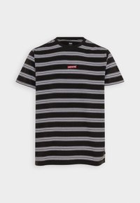 T-shirt à manches courtes à rayures noires et blanches. Présente un logo Levi's rouge sur la poitrine. Matière en coton avec une texture douce.