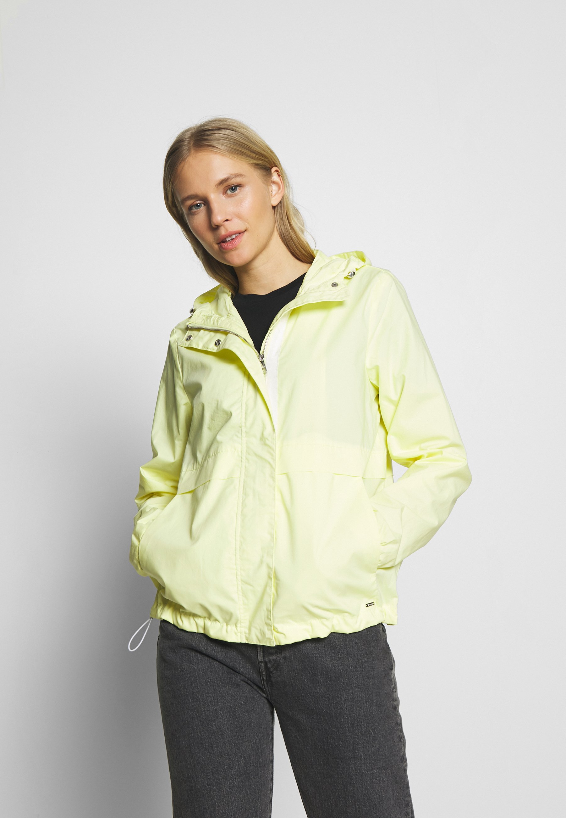 light yellow windbreaker