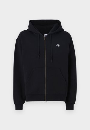 Black zippered hoodie with a hood, front pockets, elastic cuffs, and a small white logo on the left chest. Made from soft fabric.