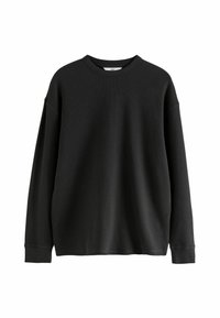 Sweat-shirt noir à manches longues en tissu texturé, doté d'un col rond et d'épaules tombantes pour une coupe décontractée.
