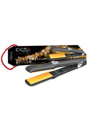Piastra per capelli piatta nera e dorata con selettore di temperatura, insieme a confezione nera con testo dorato e manico in corda rossa.