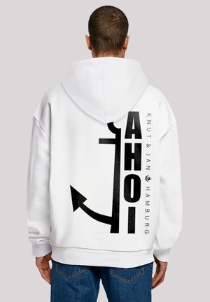 White hoodie featuring a large black anchor graphic and text reading "AHOI" along with "KNUT & JAN HAMBURG" in bold black font on the back.