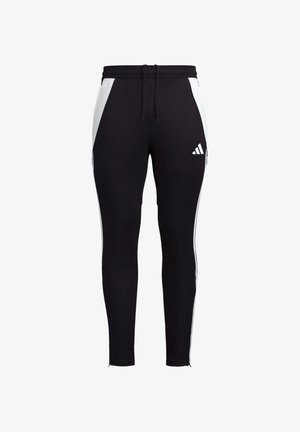 Pantaloni sportivi neri con pannelli laterali bianchi, vestibilità slim, vita elasticizzata con cordino e un piccolo logo bianco sulla parte inferiore della gamba sinistra.