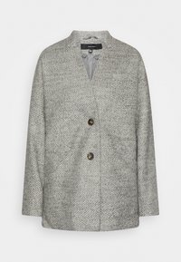 Grauer Mantel im Fischgrätmuster mit kragenlosem Design, ausgestattet mit zwei auffälligen Knöpfen und einem glatten Innenfutter.