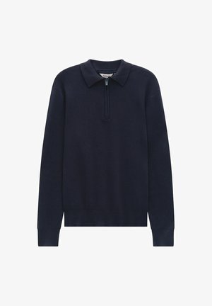 Merino villapaita tummansinisellä värillä, kauluksella, neljänneksen pituisella vetoketjulla, pitkät hihat ja resorikuvioiset hihansuut ja helma, valmistettu pehmeästä puuvillasekoitemateriaalista.