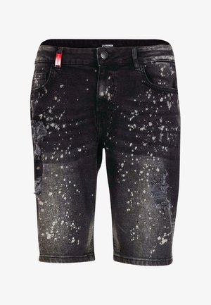 Čierne denimové šortky s poškodeným dizajnom, bielymi fľakmi, rozstrapkanými okrajmi a s predným zapínaním na gombík.