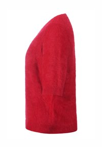Suéter de punto rojo con mangas cortas, corte holgado, textura suave y silueta relajada. No se observan patrones ni herrajes.