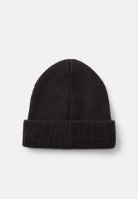 Black knitted beanie featuring a ribbed texture and a folded cuff. The design is simple with a rounded crown shape.