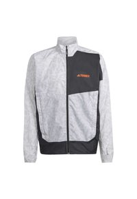 Veste zippée gris clair et noir avec col montant, manches longues, logo orange "TERREX" sur panneau poitrine noir.
