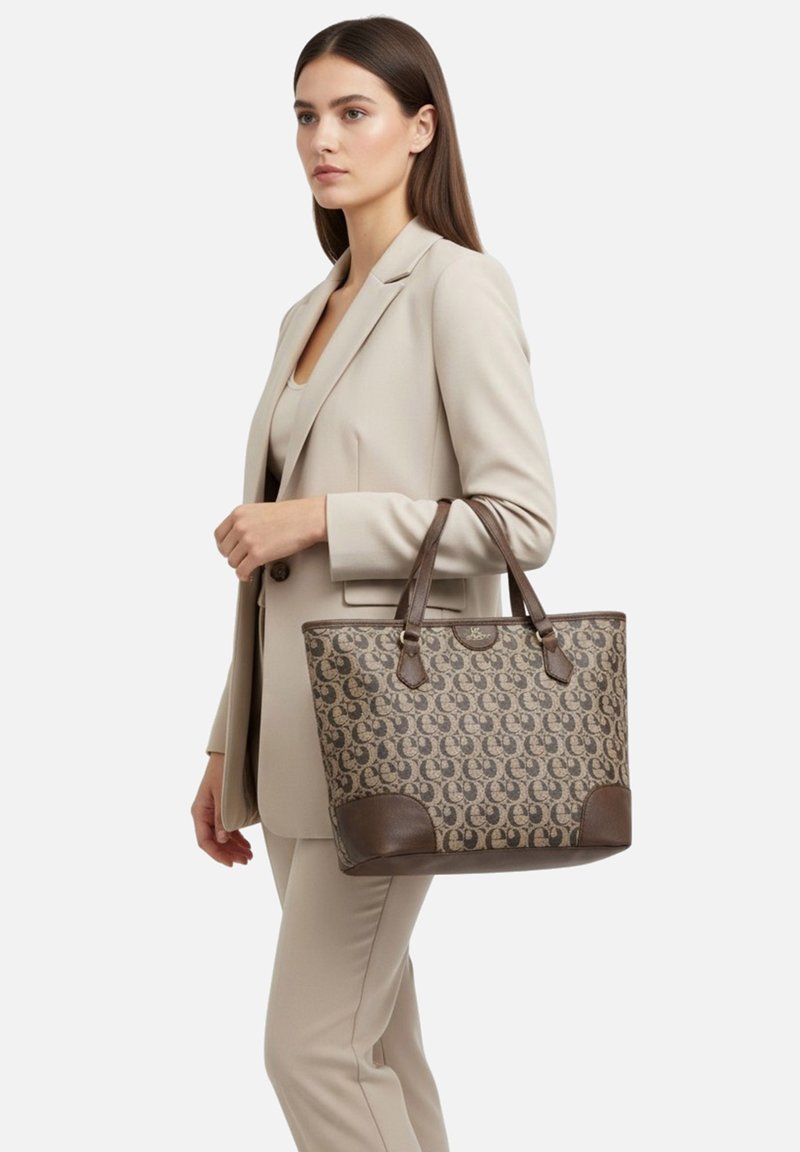 Borsa tote in pelle marrone e tessuto con motivo, con doppi manici, base marrone a contrasto e dettagli.