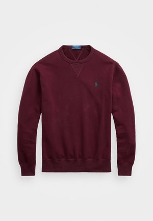Burgundy sweatshirt made of soft cotton, featuring a crew neckline, ribbed cuffs and hem, with a small green logo on the left chest.