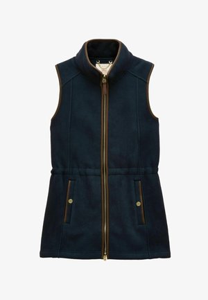 Tumes sinine fliisvest kõrge kraega, lukuga ees, pruuni äärega, küljetaskutega ja tekstuurse kangaga. Omab kergelt kitsenevat taljet, et anda vorm.