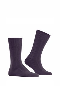 Lila gerippte Socken mit einer strukturierten Oberfläche, in einem knöchellangen Design und verstärkter Spitze. Hergestellt aus weichem, dehnbarem Material.