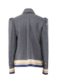 Marineblau gestreifte Jacke mit strukturierten Schultern, die ein geometrisches Design aufweist, kontrastierenden Beigen und blauen Säumen sowie einem Kragen.